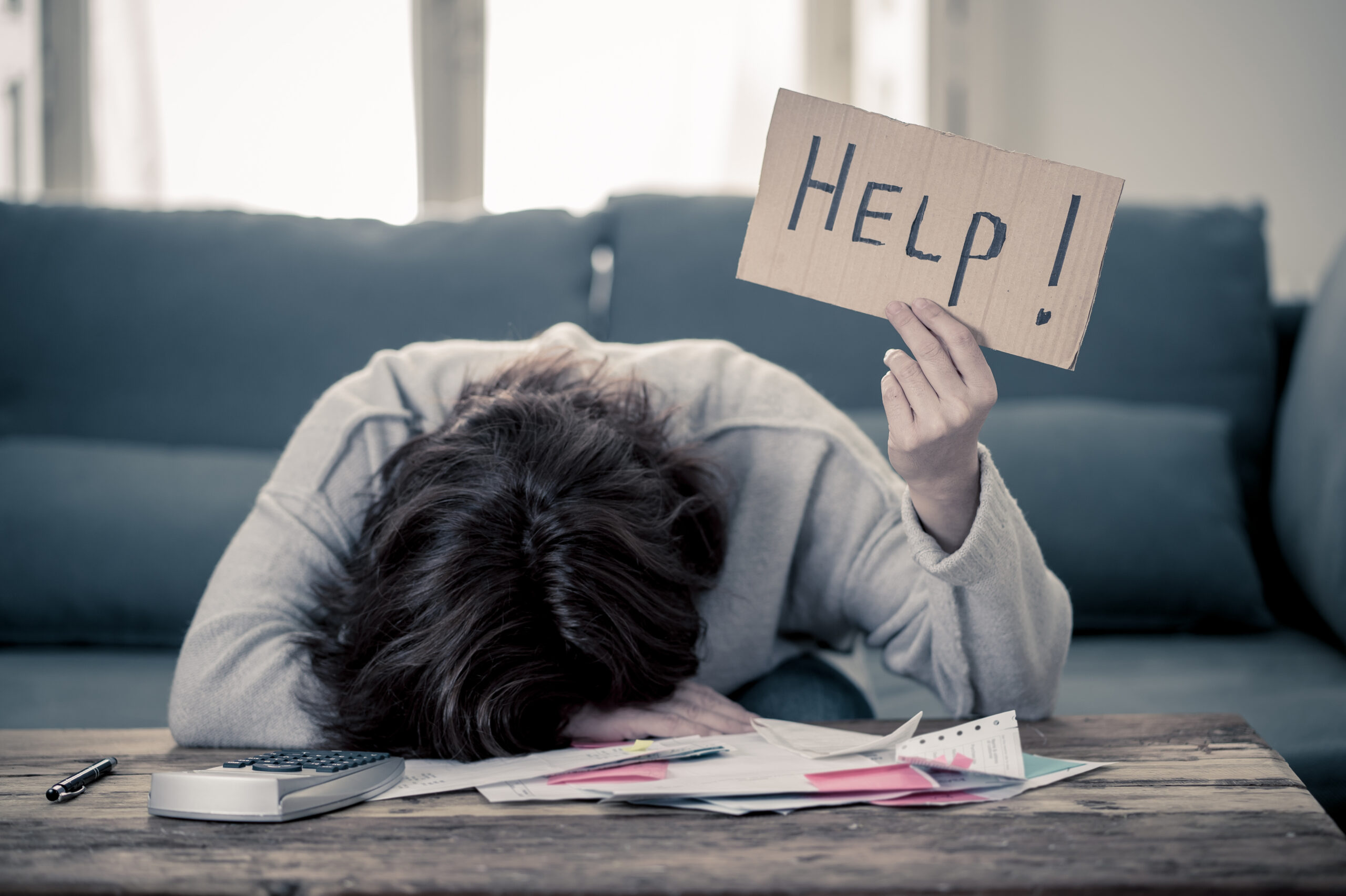 Upset young woman asking for help in paying bills Mortgage home or business finance problems